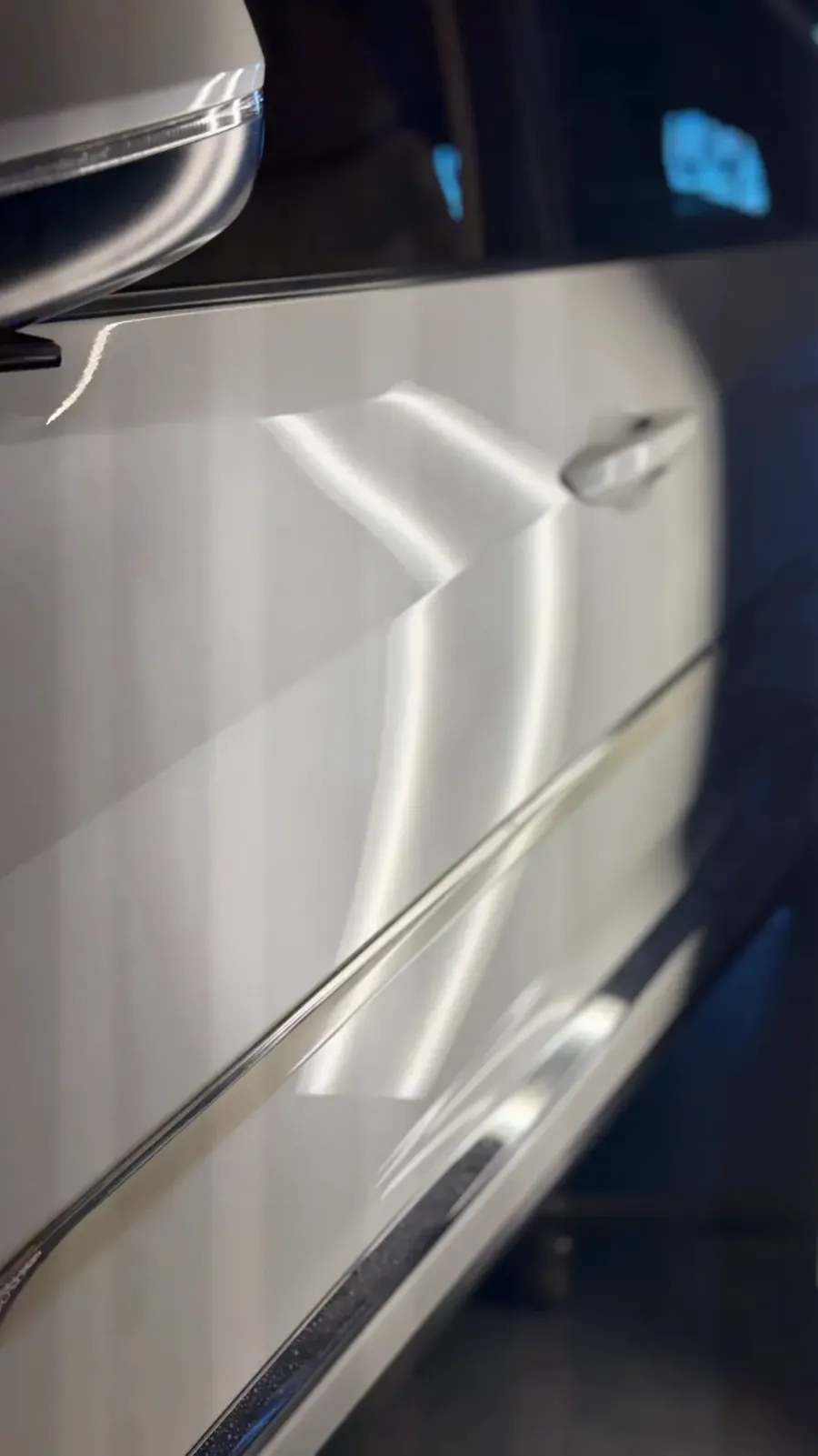 Paintless dent repair before and after on tan SUV rear door crease near handle in Garland TX
