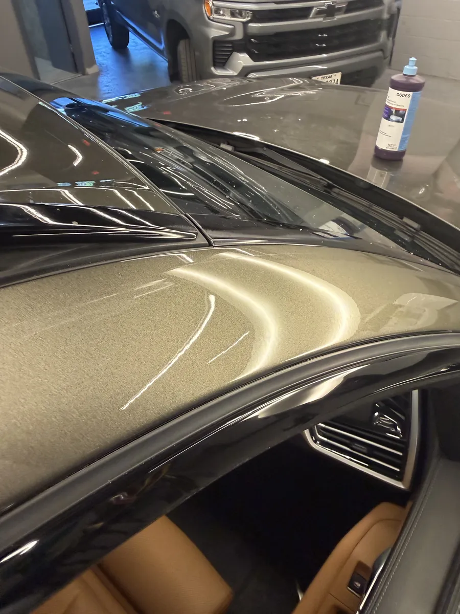Paintless dent repair before and after on vehicle panel in Garland TX