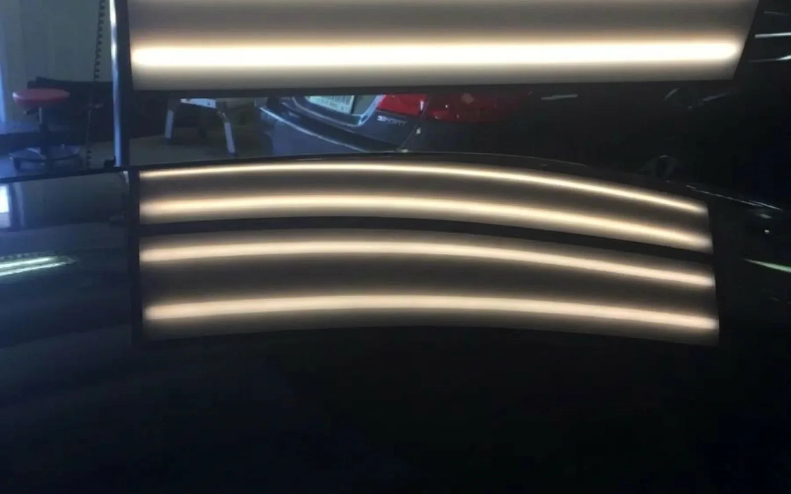 Before and after paintless dent repair on a vehicle at A+ Dent Solutions shop in Garland TX